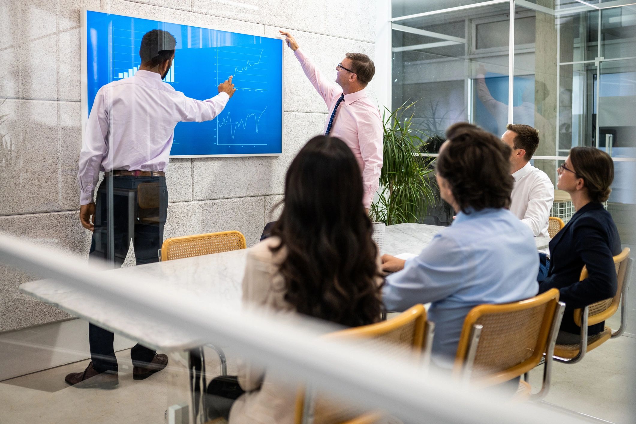 Corporate team reviewing financial statistics